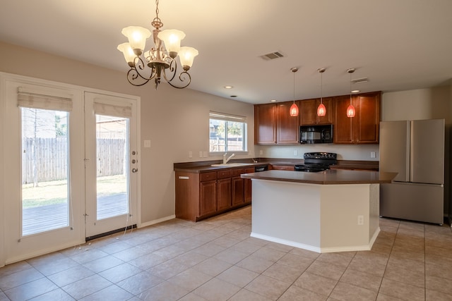 kitchen featuring a chandelier, hanging light fixtures, black appliances, light tile patterned floors, and sink