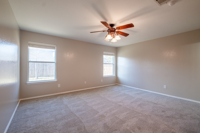 carpeted empty room with ceiling fan