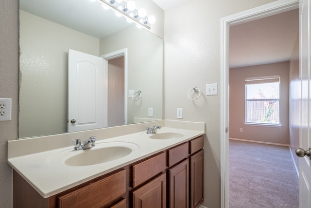 bathroom featuring dual vanity