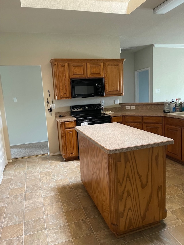 kitchen with black appliances and a kitchen island