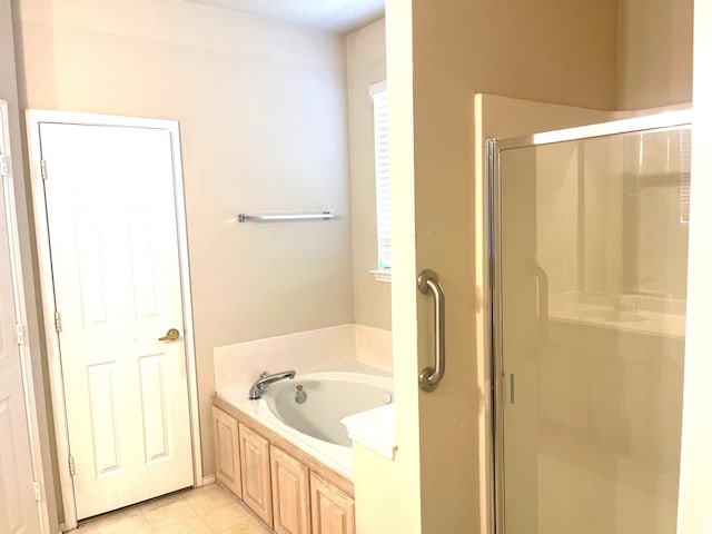 bathroom with tile patterned flooring and plus walk in shower