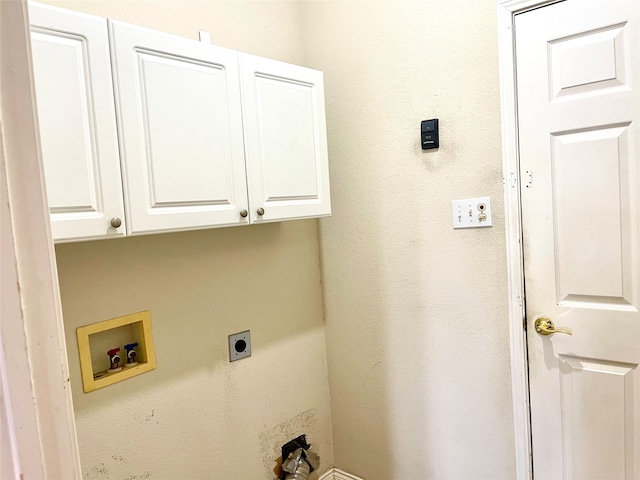 laundry room with hookup for a washing machine, cabinets, and electric dryer hookup