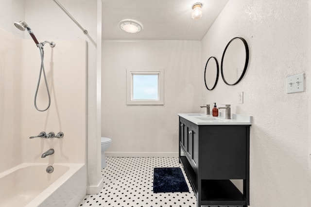 full bathroom featuring vanity, toilet, tile patterned flooring, and bathing tub / shower combination