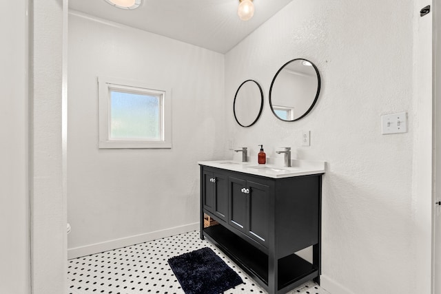 bathroom featuring double vanity and tile patterned flooring