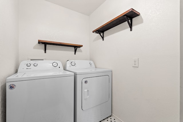 laundry area featuring separate washer and dryer and tile patterned flooring