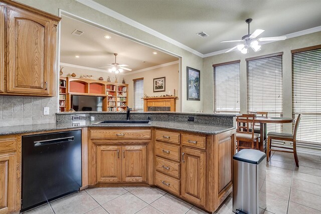 kitchen with light tile patterned flooring, black dishwasher, backsplash, ceiling fan, and sink