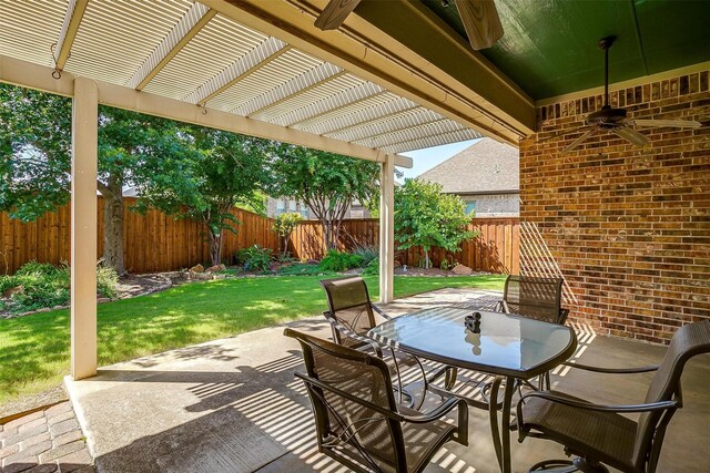 view of patio / terrace with ceiling fan and a pergola