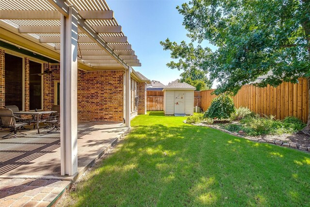 view of yard featuring a pergola, a shed, and a patio area