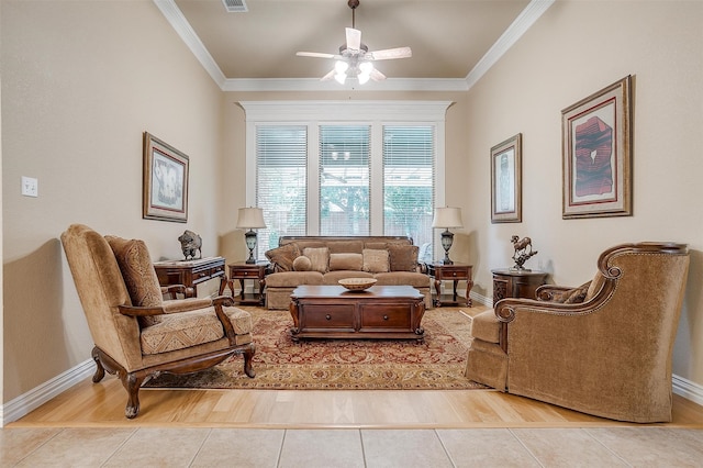 living room featuring ceiling fan, crown molding, and light hardwood / wood-style flooring