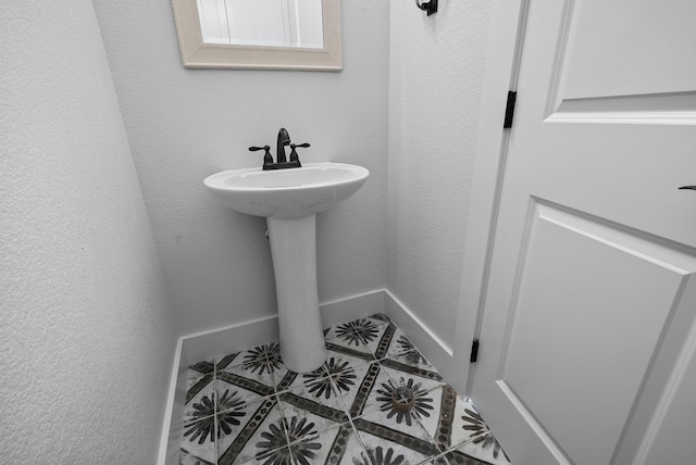 bathroom featuring tile patterned floors and sink