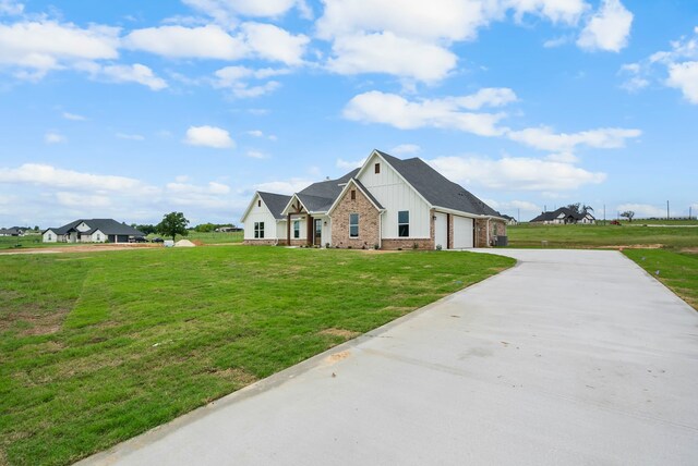 view of front facade with a front lawn and a garage