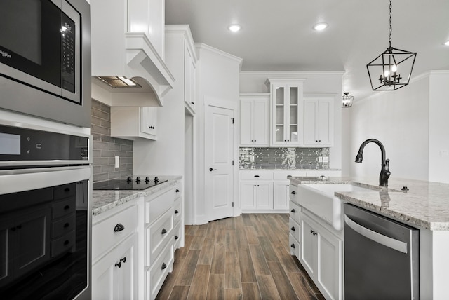 kitchen with white cabinetry, custom range hood, stainless steel appliances, and dark hardwood / wood-style floors