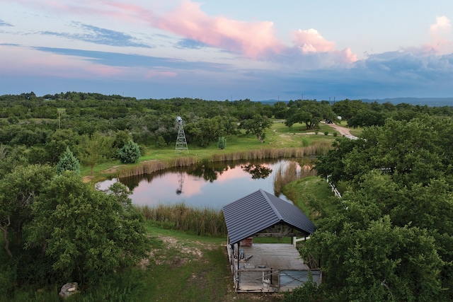 aerial view at dusk with a water view