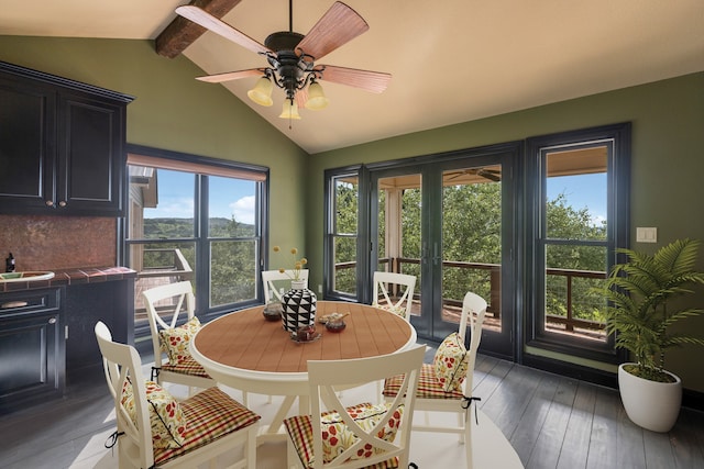 dining space with lofted ceiling with beams, hardwood / wood-style flooring, and ceiling fan