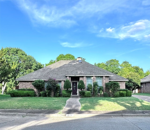 ranch-style house with a front yard