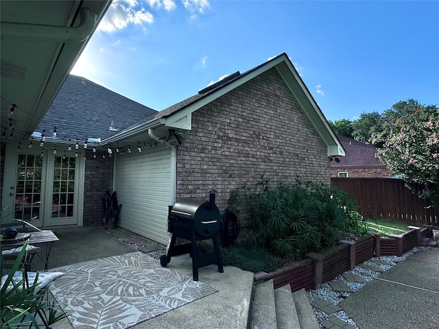 view of property exterior with a patio