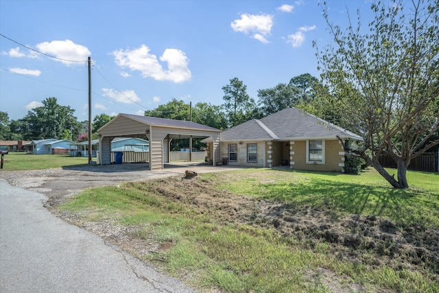 single story home featuring a front yard and a carport