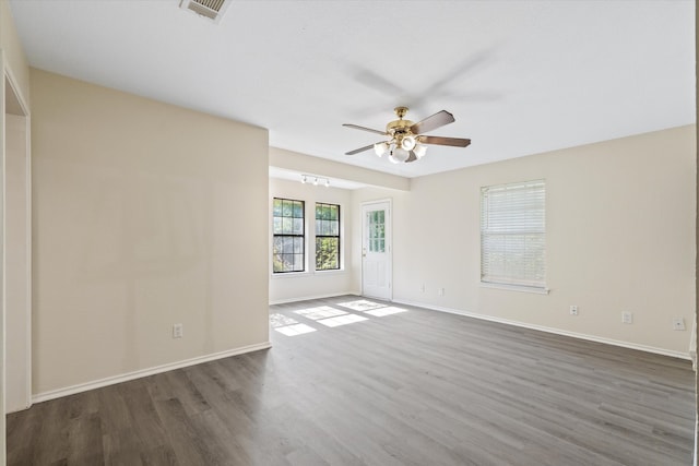 spare room featuring ceiling fan and hardwood / wood-style flooring