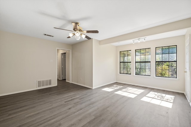 unfurnished room with hardwood / wood-style flooring, rail lighting, and ceiling fan