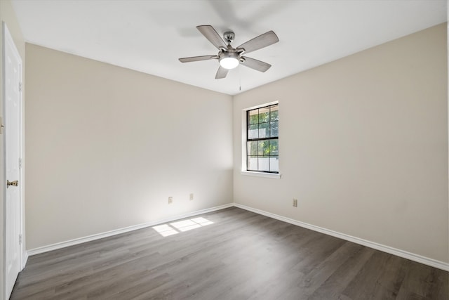 empty room with ceiling fan and wood-type flooring