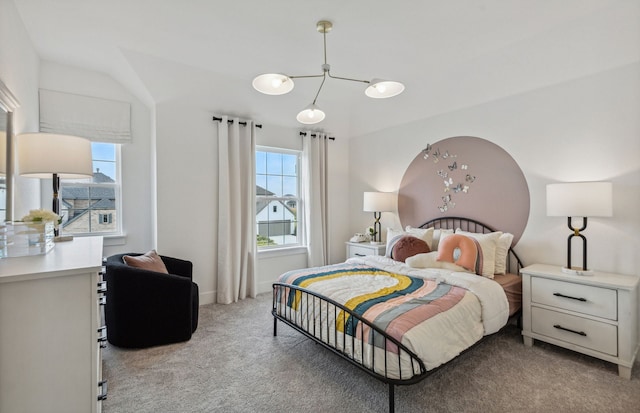 bedroom featuring light colored carpet and multiple windows