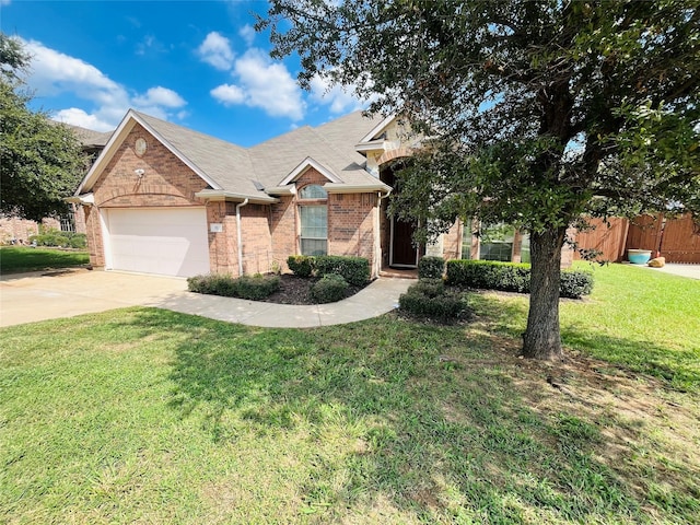 view of front of house featuring a garage and a front yard