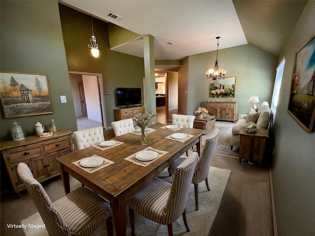 carpeted dining area featuring lofted ceiling and an inviting chandelier