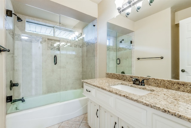 bathroom with shower / bath combination with glass door, vanity, and tile patterned floors