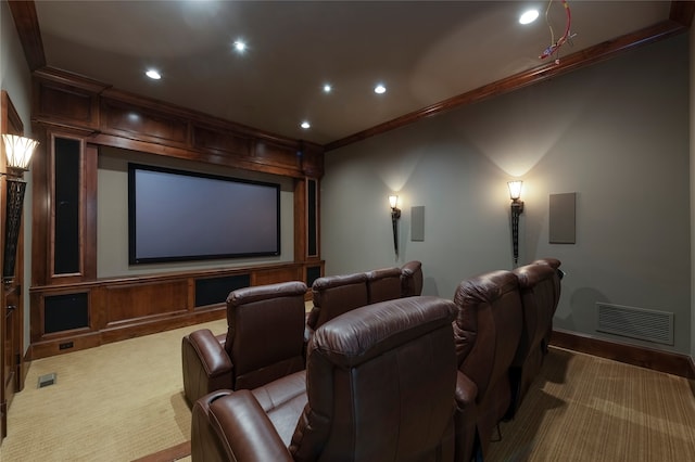 cinema with carpet flooring and ornamental molding