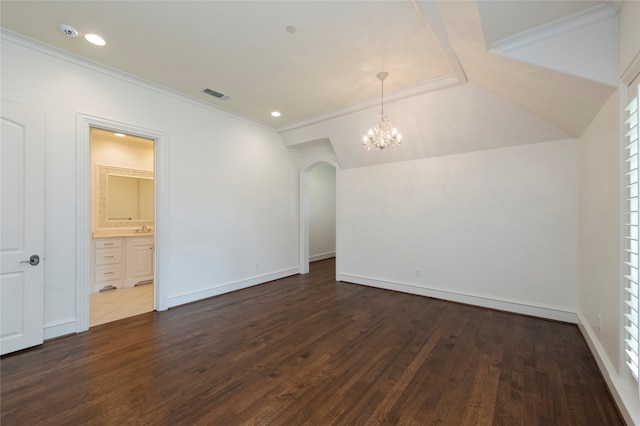 tiled spare room featuring sink, an inviting chandelier, and lofted ceiling