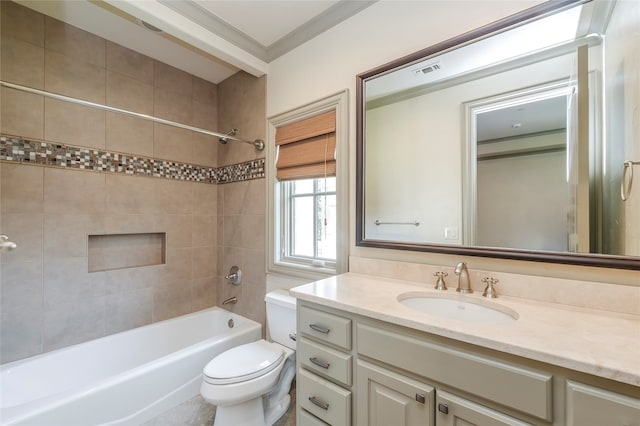 full bathroom with ornamental molding, tiled shower / bath, vanity, and toilet