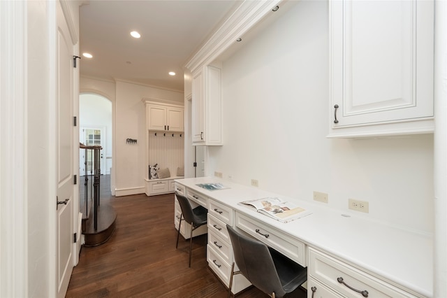 kitchen with crown molding, dark hardwood / wood-style flooring, and white cabinets