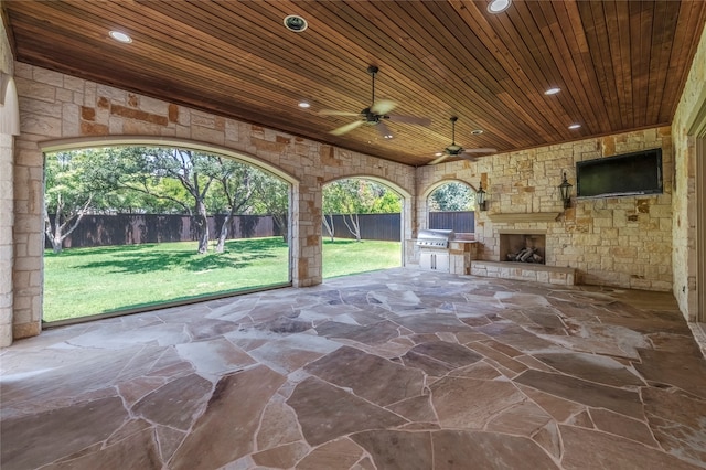 view of patio with ceiling fan and area for grilling