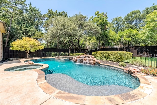 view of pool with an in ground hot tub and pool water feature