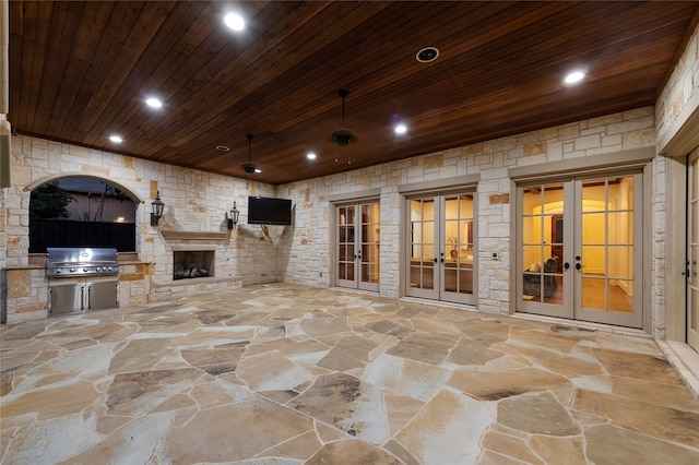 view of patio / terrace with exterior kitchen, french doors, and area for grilling