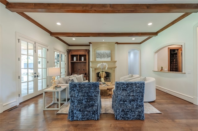 living room featuring french doors, dark hardwood / wood-style floors, and ornamental molding