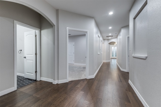 hallway featuring dark wood-type flooring