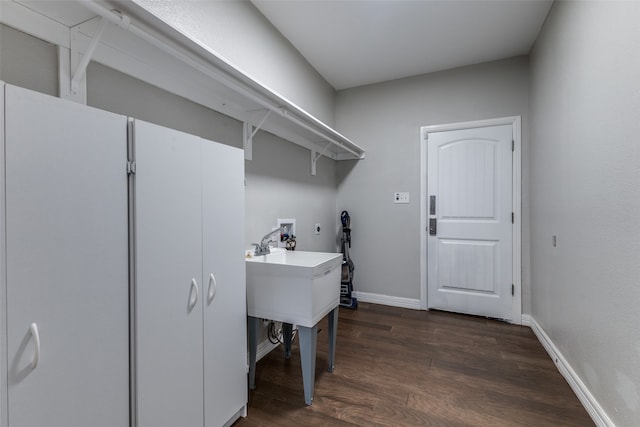 laundry room with electric dryer hookup, dark hardwood / wood-style floors, and hookup for a washing machine