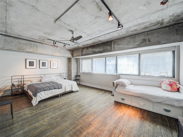 bedroom with ceiling fan and wood-type flooring