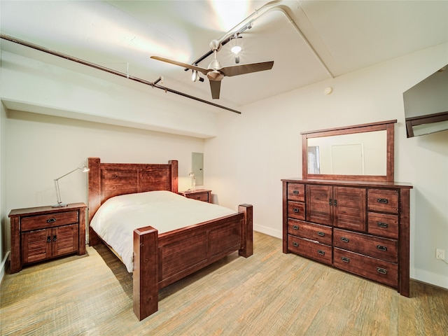 bedroom featuring ceiling fan and light hardwood / wood-style flooring