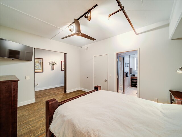 bedroom featuring ceiling fan, hardwood / wood-style flooring, and rail lighting