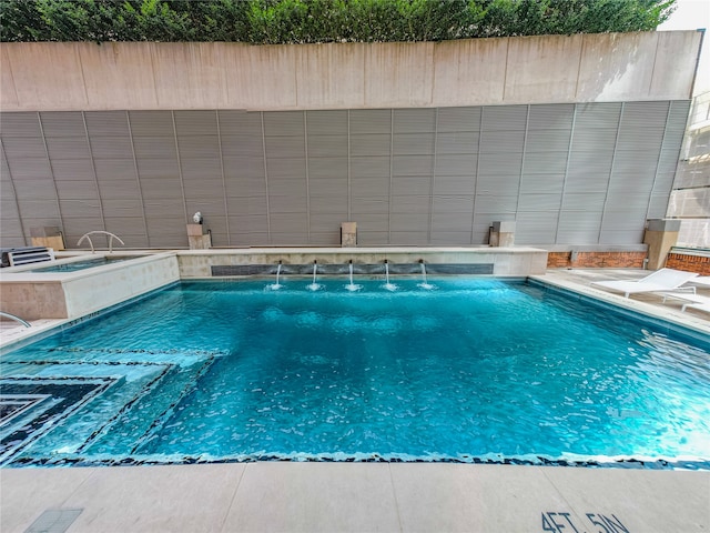 view of pool with pool water feature