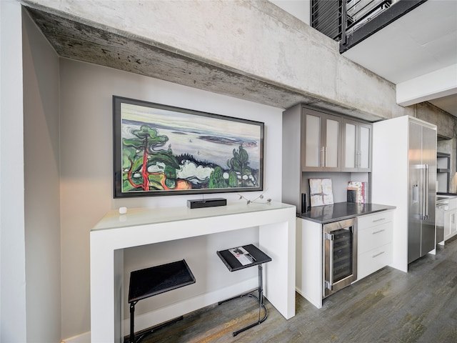 kitchen with dark wood-type flooring and wine cooler