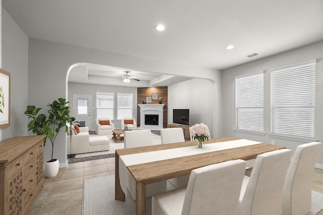 dining space with ceiling fan and light tile patterned floors