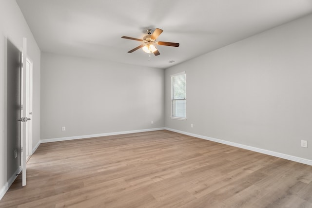 empty room featuring light hardwood / wood-style flooring and ceiling fan