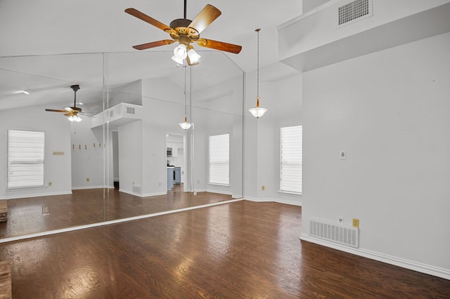 unfurnished living room featuring ceiling fan, dark hardwood / wood-style floors, and high vaulted ceiling