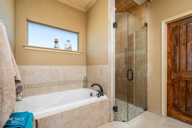 bathroom featuring tile patterned floors, ornamental molding, and independent shower and bath