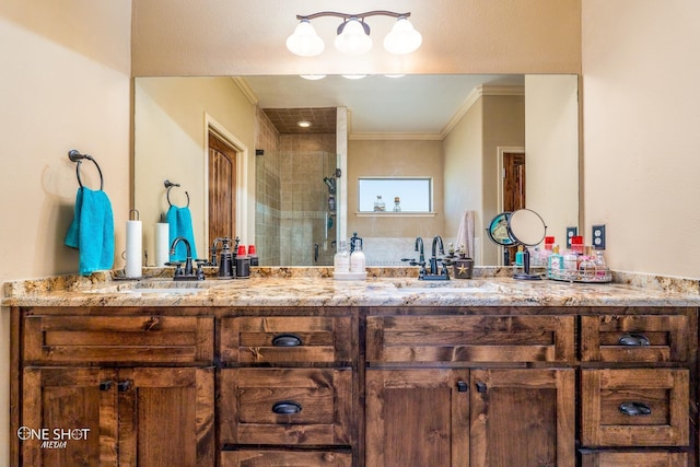 bathroom with ornamental molding, vanity, and walk in shower