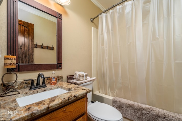 full bathroom featuring toilet, ornamental molding, vanity, and shower / tub combo