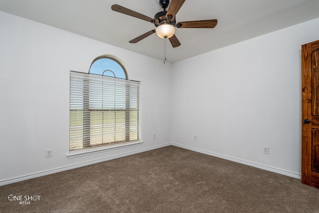 unfurnished room with carpet and ceiling fan